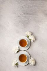 Two cups of tea for March 8th in flowers