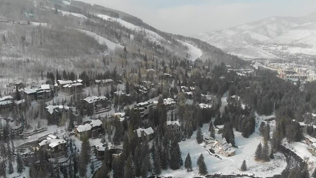 Aerial View Flying over the Vail Village town in Colorado during winter season, USA