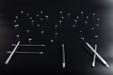 Word FIX with tools and spare parts. Text FIX on black background.