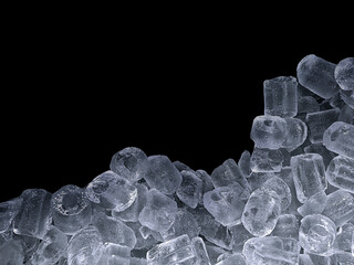 Pieces of crushed ice cubes on black background