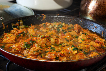 pork fillet stewed in a pan, goulash