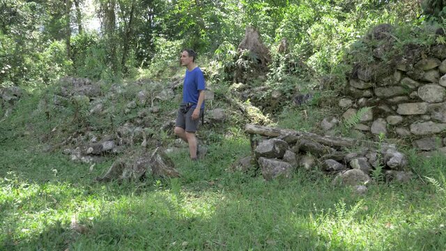 Vilcabama ruins in middle of the jungle, peruvian culture, archaeological site with male model, pre hispanic culture in peru.