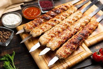 lula kebab with vegetables on cutting board