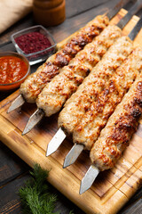 lula kebab with vegetables on cutting board