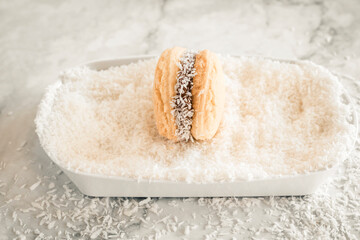 alfajor de cornstarch, typical of Argentina made with dulce de leche and coconut