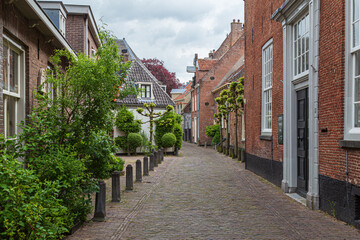 Fototapeta na wymiar Wall houses in the old medieval center of the Dutch medium-sized historic city of Amersfoort