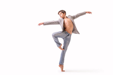 A teenage ballet dancer poses barefoot, isolated on a white background.