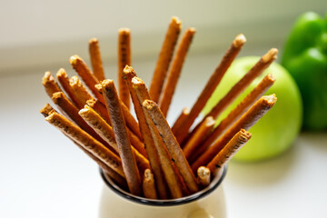 Bread straws in a light glass