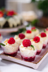 Tasty mousse desserts with jelly and berries in a glass