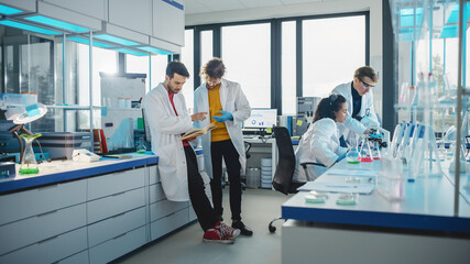Modern Medicine Laboratory: Diverse Team of Multi-Ethnic Young Scientists Analysing Test Samples. Advanced Lab with High-Tech Equipment, Microbiology Researchers Design, Develop Drugs, Doing Research