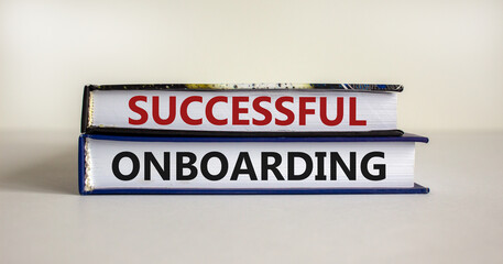 Successful onboarding symbol. Books with words 'successful onboarding' on beautiful white background. Business and successful onboarding concept. Copy space.
