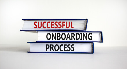Successful onboarding process symbol. Books with words 'Successful onboarding process' on beautiful white background. Business and Successful onboarding process concept. Copy space.