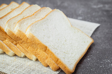 Sliced bread on dark grunge background