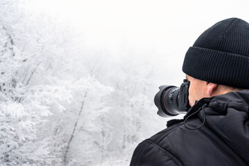 Fototapeta na wymiar Nature photographer take shoot of winter landscape