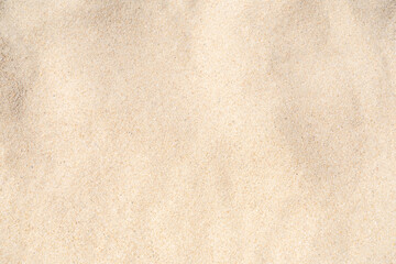 Obraz na płótnie Canvas Sand texture background. Brown desert pattern from tropical beach.
