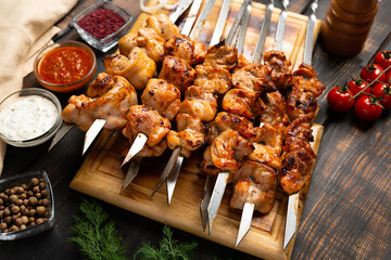 fresh roast chicken shish kebab on cutting board