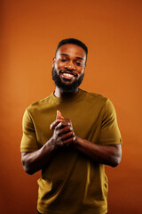 young pretty african american man posing cheerful on brown background, lifestyle people concept