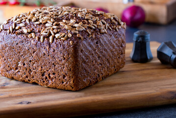 fresh Sunflower seed bread on a wooden cutting board