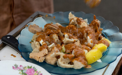 a plate of Indonesian street food from bandung called shumai or dimsum