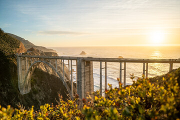 Bixby Creek Bridge along Big Sur coast during golden sunset