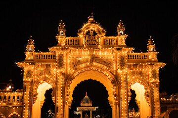 kings living royal palace vintage entrance gate illuminated at night with tungsten bulb