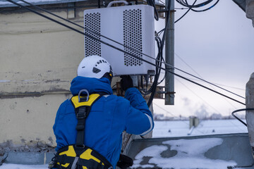 Cell phone installers work on the tower	

