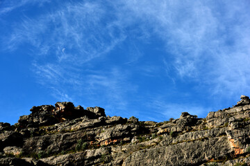 Blue sky, a day moon and cloud patterns over the Matroos Mountain in the Karoo South Africa