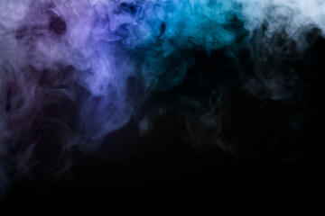 colored pink and blue smoke on black