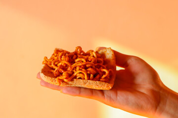 close up of a hand holding a slice