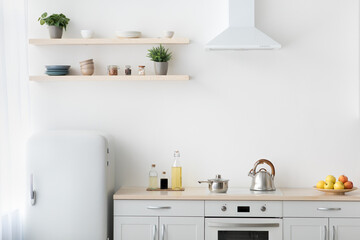 Fototapeta na wymiar Stylish modern apartment with minimalist kitchen and Scandinavian interior