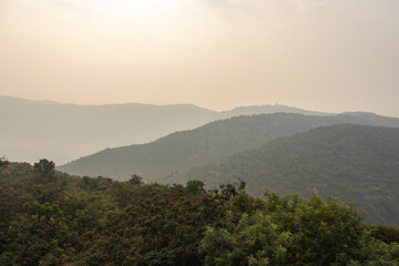Fototapeta na wymiar mountain range with white mist view at dawn