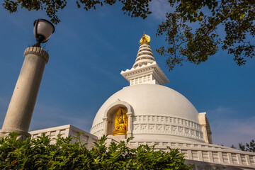 buddhist stupa isolated with amazing blue sky from unique perspective