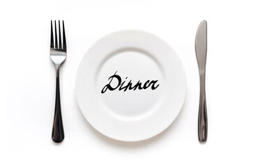 A white plate on which the word Diet is written standing on a tablecloth . The concept of a balanced diet, ration and medical fasting. Top view, white background, copy space.