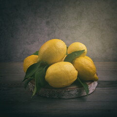 Lemon on wood, still life. Lemons, fruit for vitamins. 