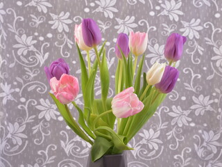 Tulips. Bouquet of flowers in vase. Tulip still life. 