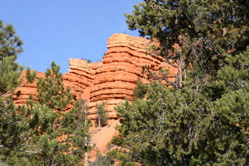 Southwest Red Sandstone Landscape with Mountain Bluffs and Ledges Eroded By Wind and Weather with a...