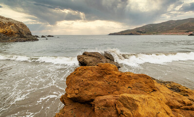Rock formations against the backdrop of the ocean in the San Francisco Recreation Area, Rodeo Beach, California, USA. Seaside, beautiful landscape, California coast.
