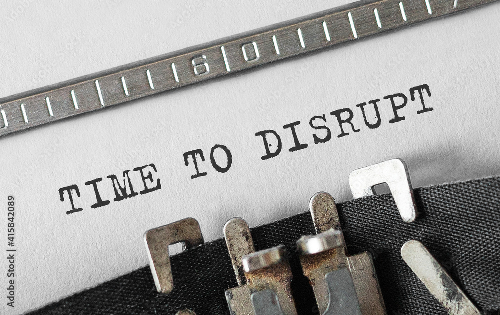 Poster text time to disrupt typed on retro typewriter