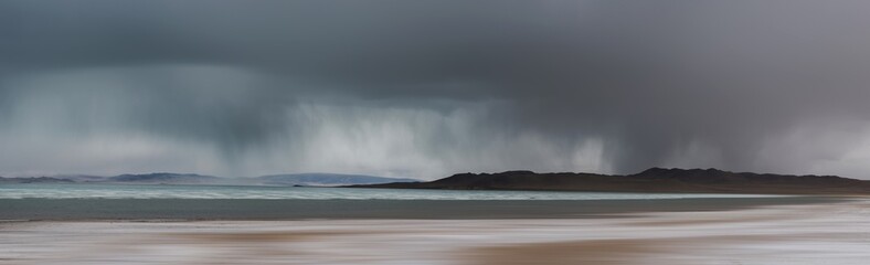 picturesque view of sea surrounded by rocky coast in morning 