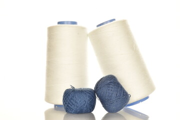 Two coils of white and two coils of blue, close-up, isolated on white.