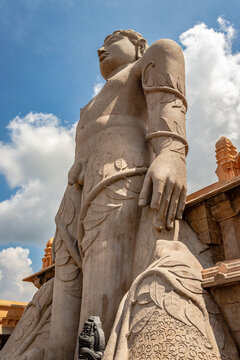 idol of a deity stone statue symbolizing Peace in Jainism with blue sky from different angles