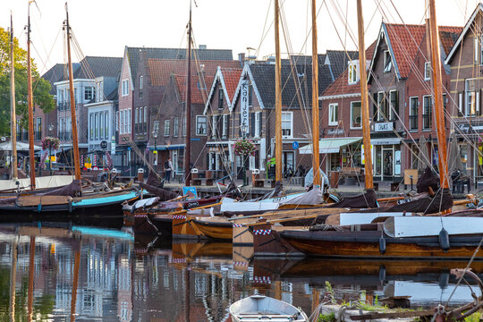 View of the harbor of the Dutch fishing village of Spakenburg in the former Zuiderzee with old traditional Botter fishing boats.