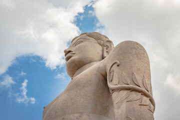 idol of a deity stone statue symbolizing Peace in Jainism with blue sky from different angles