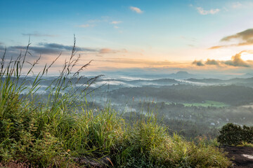 mountain layers covered with white mist at dawn