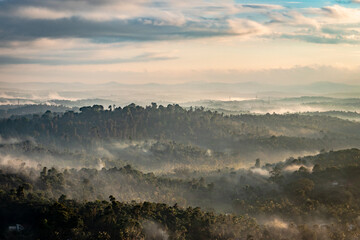 mountain layers covered with white mist at dawn