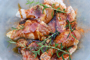 chicken  mixed with sauce and herbal ingredient in cooking grilled