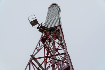 old abandoned lighthouse on the islands in Lake Onega, photo in winter.