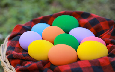 Colorful eggs in basket with fabric in Easter day celebrations for holiday