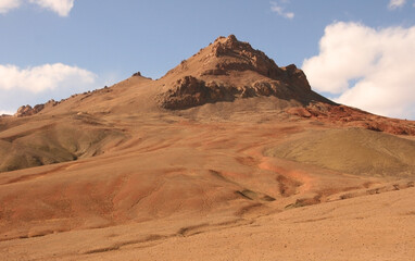 Fototapeta na wymiar Panoramic view of high-altitude red desert on the Pamir Highway between Murghab and Ak Baital pass, Gorno-Badakshan, Tajikistan