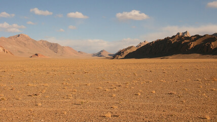 Fototapeta na wymiar Panoramic view of high-altitude red desert on the Pamir Highway between Murghab and Ak Baital pass, Gorno-Badakshan, Tajikistan